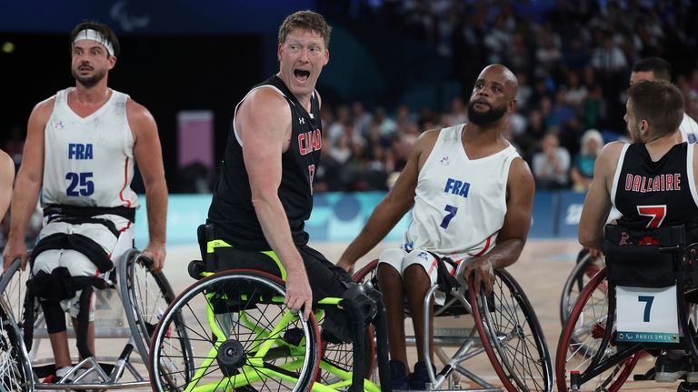 Canada's Patrick Anderson yells out at his teammate during the...