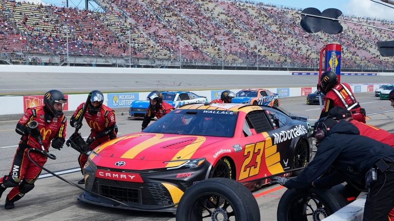 Bubba Wallace makes a pitstop during a NASCAR Cup Series...