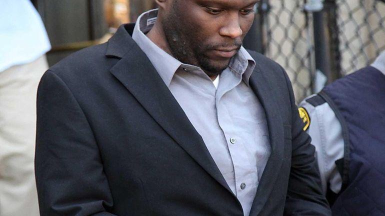 Accused cop killer Darrell Fuller leaves the Nassau County Courthouse...