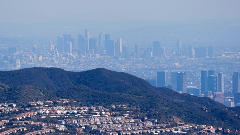 Downtown Los Angeles, above, is seen from the Topanga area...