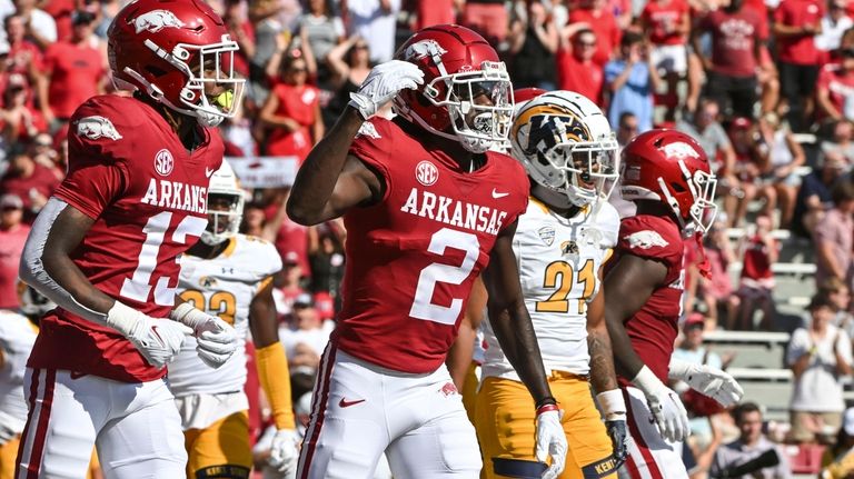 Arkansas wide receiver Andrew Armstrong (2) celebrates with Jaedon Wilson...