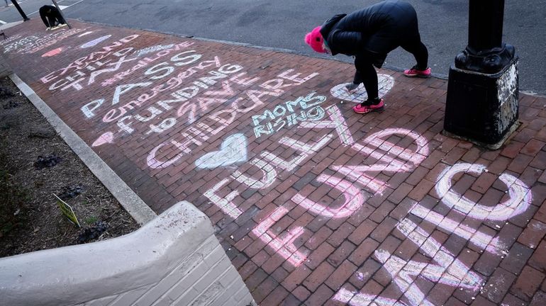 Sidewalk art near Capitol Hill asks lawmakers to expand the...