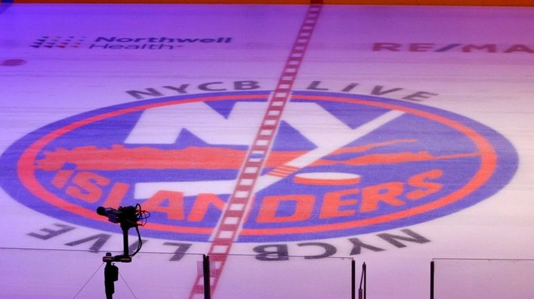 The Islanders logo at center ice during the playoffs against...