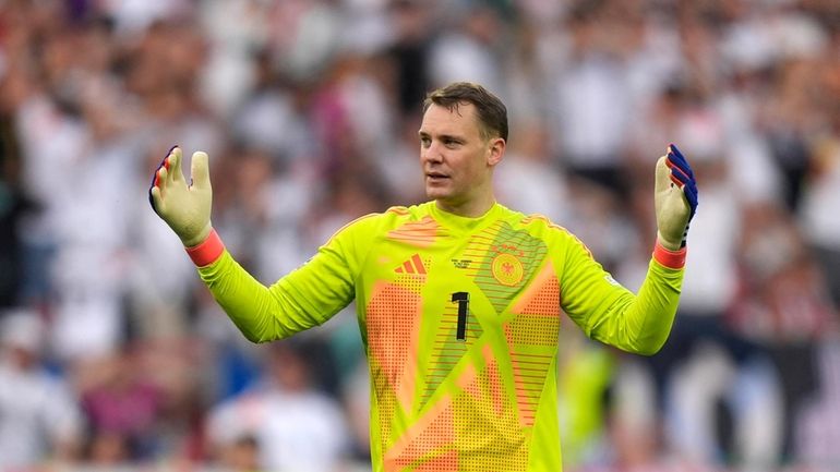 Germany's goalkeeper Manuel Neuer reacts during a quarter final match...