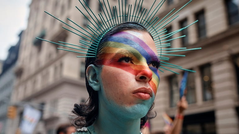A reveler performs during the NYC Pride March, Sunday, June...