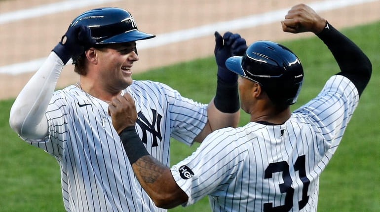 Luke Voit of the Yankees celebrates his first-inning three-run home...