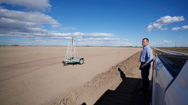 Tom Brundy looks over a field that is in preparation...