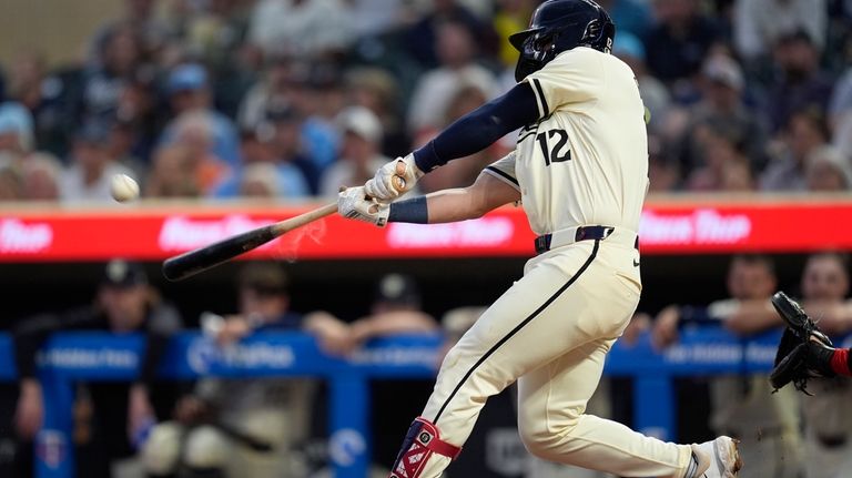 Minnesota Twins' base Kyle Farmer hits a 3-run home run...