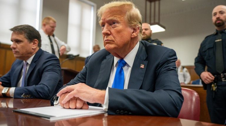 Former President Donald Trump appears at Manhattan criminal court during...