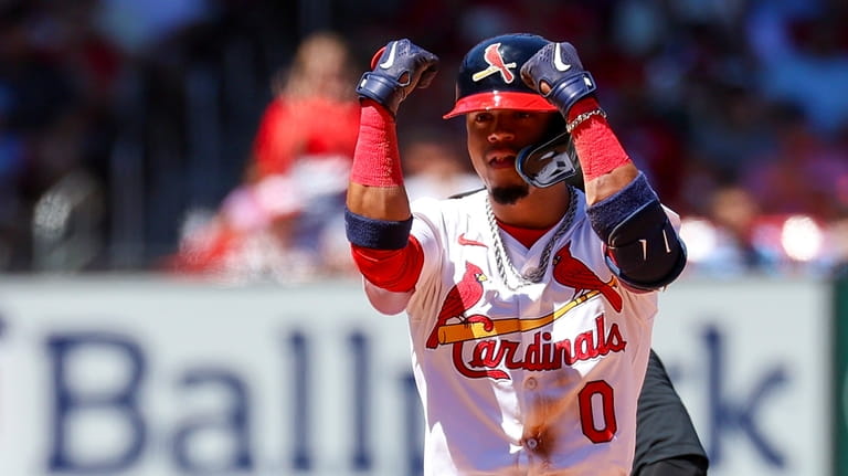 St. Louis Cardinals' Masyn Winn gestures toward the dugout after...