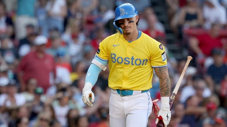 Boston Red Sox's Jarren Duran reacts after striking out during...