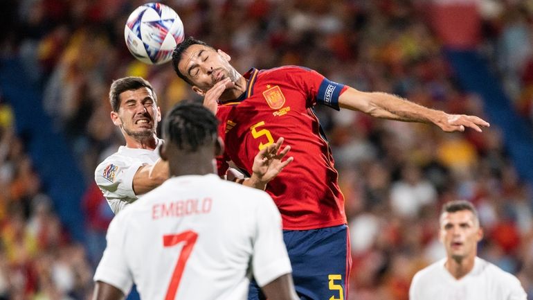 FILE - Swiss Remo Freuler, left, fights for a header...