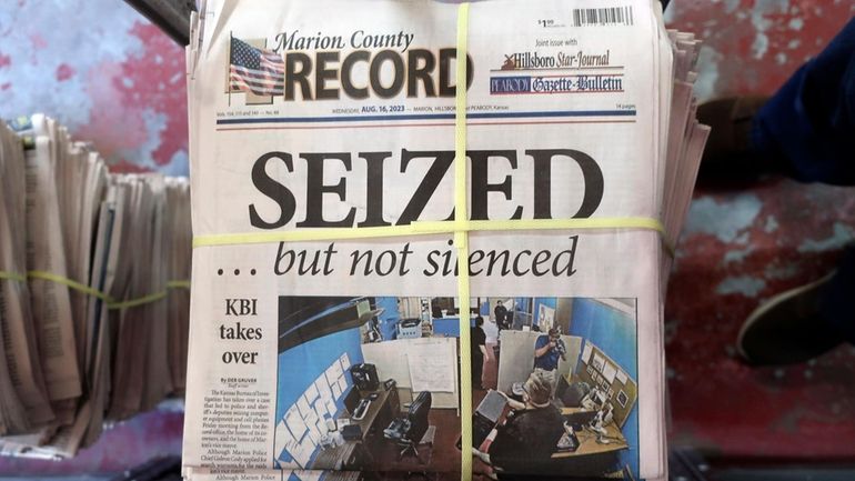 A stack of the Marion County Record sits in the...