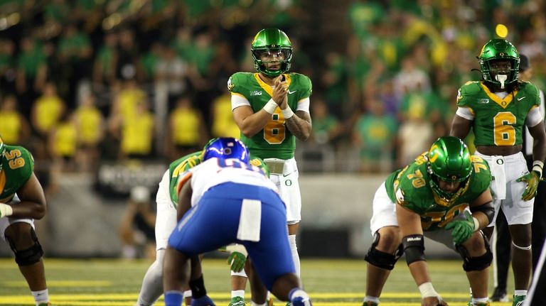 Oregon quarterback Dillon Gabriel (8) sets up a play during...