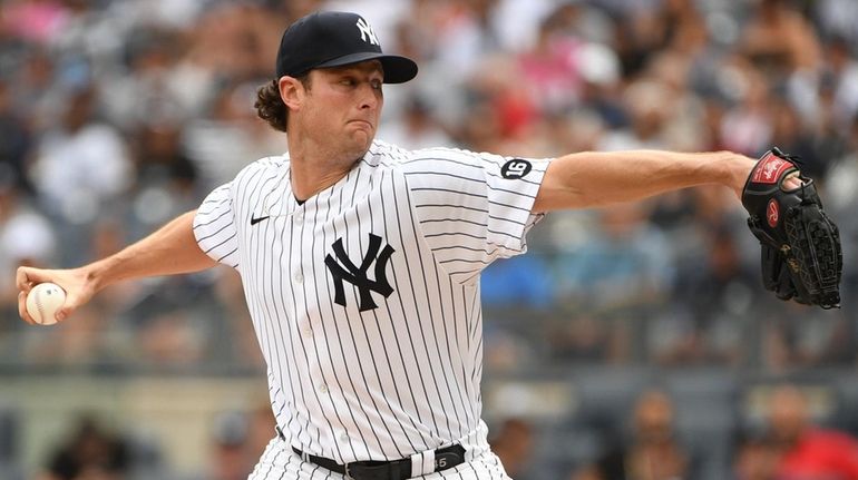 Yankees starting pitcher Gerrit Cole delivers against the Twins during...