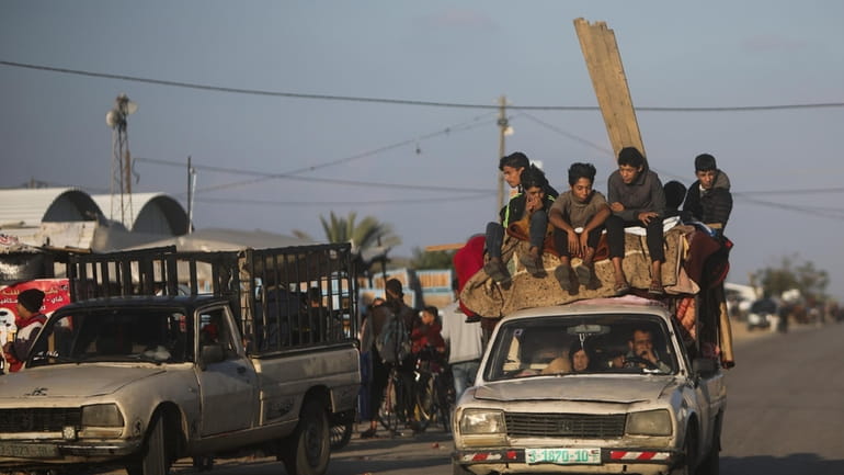 Palestinians flee the Israeli ground offensive in Khan Younis, Gaza...