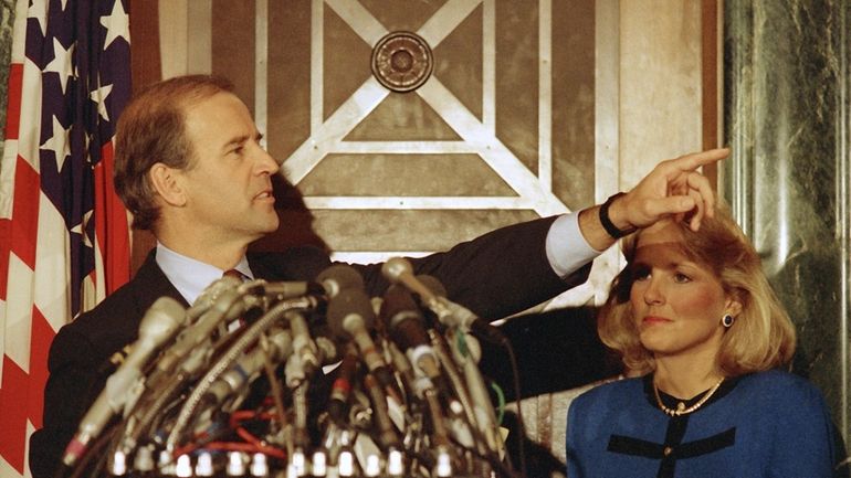 Sen. Joe Biden, D-Del., with Jill Biden, gestures during a...