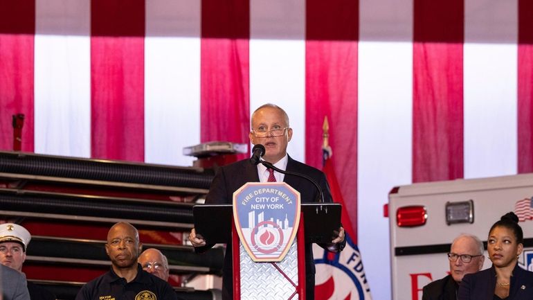 Robert Tucker addresses attendees at his swearing-in to become FDNY...