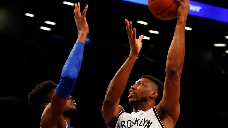 Thaddeus Young of the Nets puts up a shot in...
