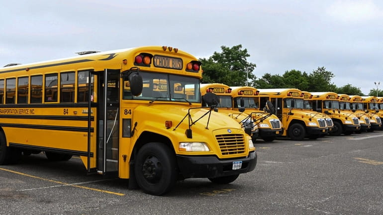 School buses are parked in a bus depot in Ronkonkoma. 