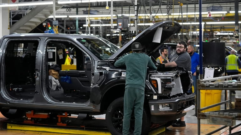 A 2024 Ford F-150 truck is assembled at the Dearborn...