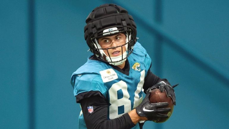 Jacksonville Jaguars wide receiver Louis Rees-Zammit runs after a catch...