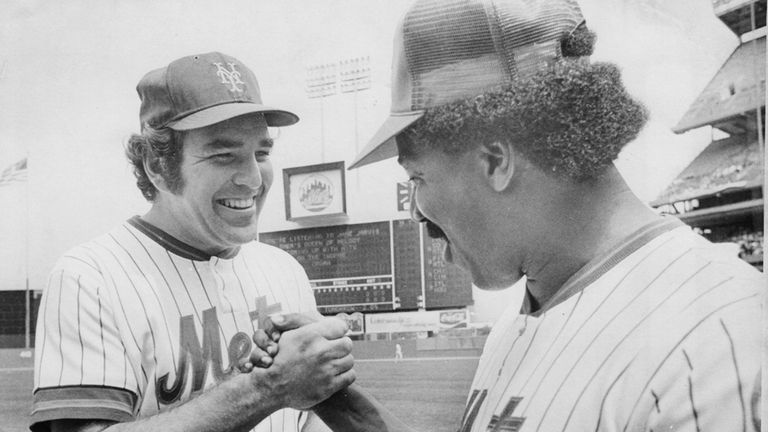 Ed Kranepool shakes hands with former Mets teammate Cleon Jones...