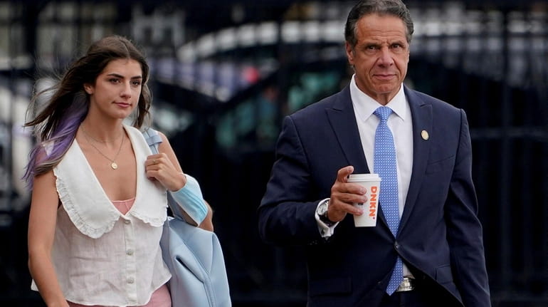 New York Gov. Andrew Cuomo prepares to board a helicopter with...