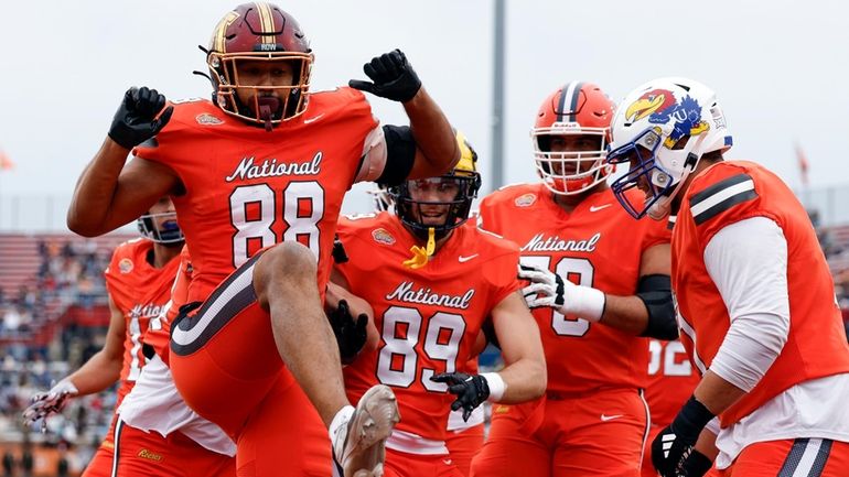 National tight end Brevyn Spann-Ford of Minnesota (88) celebrates with...