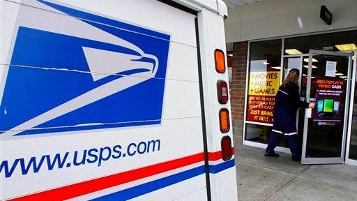 A U.S. Postal Service letter carrier picks up and delivers...