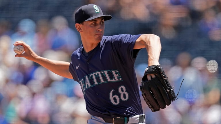 Seattle Mariners starting pitcher George Kirby throws during the first...