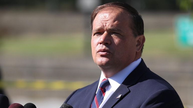 Suffolk County District Attorney Ray Tierney speaks at a news conference...