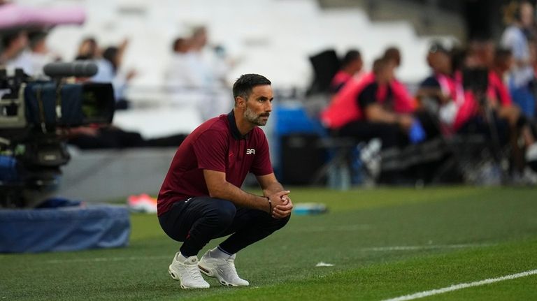 United States' head coach Marko Mitrovic watches from the sidelines...