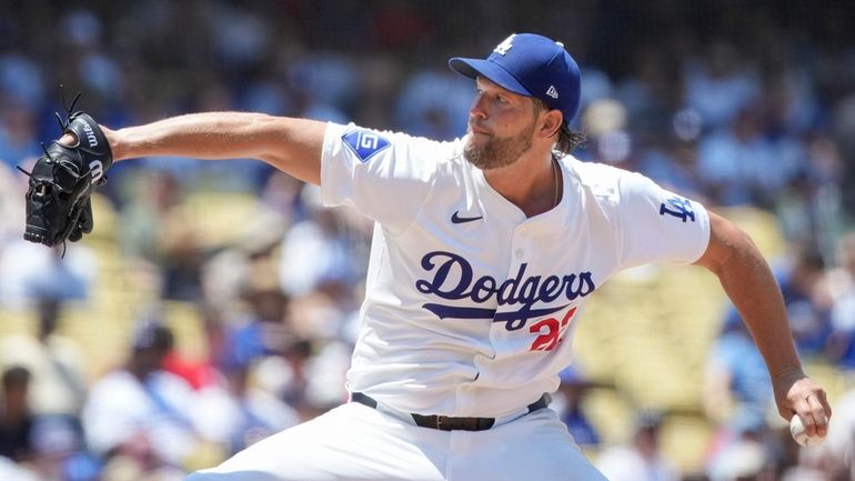 Los Angeles Dodgers starting pitcher Clayton Kershaw (22) throws a...