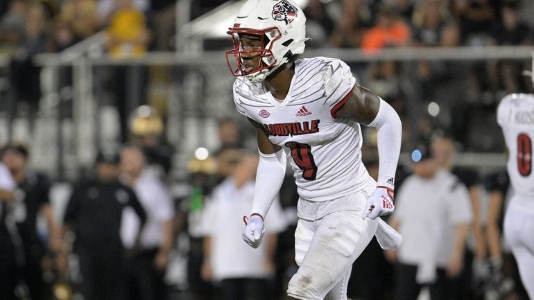 Louisville wide receiver Ahmari Huggins-Bruce sets up for a play...