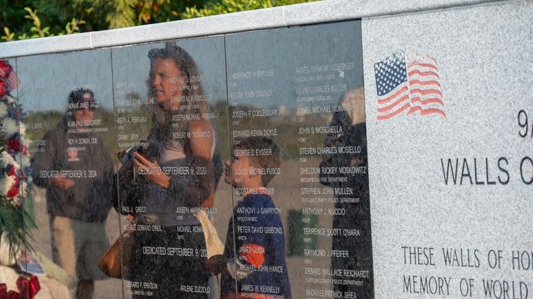 Visitors to the Town of Oyster Bay's Monday tribute to...