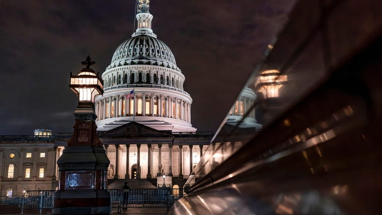 The Capitol is seen late Tuesday night, Sept. 26, 2023,...