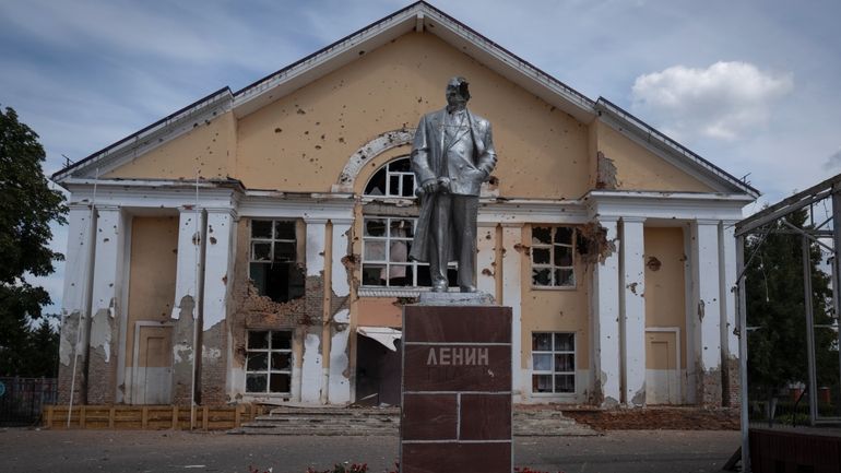 A damaged monument to Soviet founder Vladimir Lenin stands in...