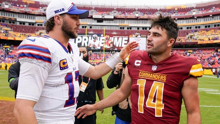 Buffalo Bills quarterback Josh Allen (17) and Washington Commanders quarterback...