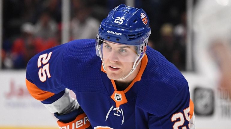 Islanders defenseman Devon Toews sets before a face off against...