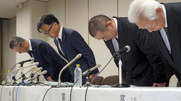 Shinji Kaneko, second left, President of Keikyu Department Store Co....