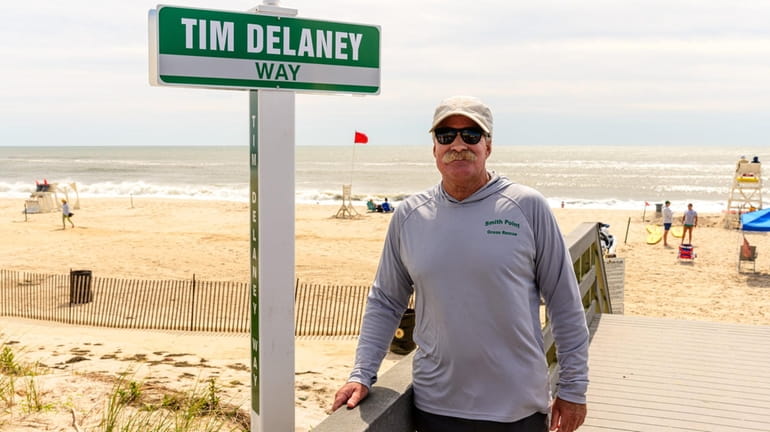 Smith Point lifeguard Tim Delaney was recognized Thursday for his 50...
