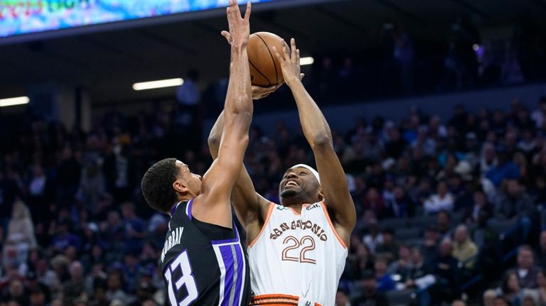 San Antonio Spurs guard Malaki Branham (22) shoots over Sacramento...