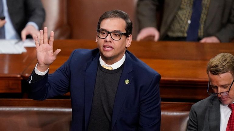 Former Republican Rep. George Santos votes during the debate over...