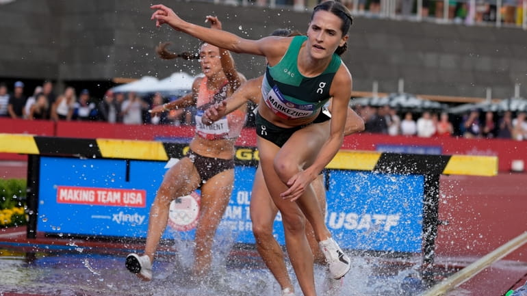 Olivia Markezich stumbles in the women's 3000-meter steeplechase final during...