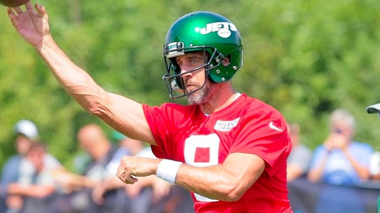 Jets QB Aaron Rodgers throws during training camp at the Atlantic Health...