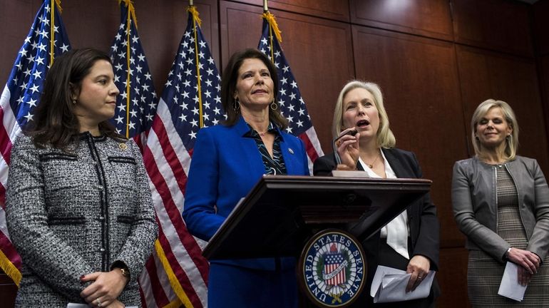 Rep. Cheri Bustos, D-Illinois, stands at the podium Wednesday on...