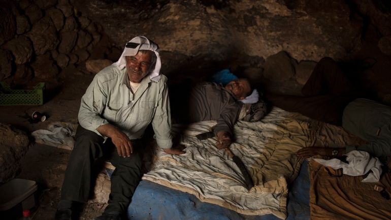 Palestinians Ribhi Ahmad Battat, left, and Issa Ahmad Battat, residents...