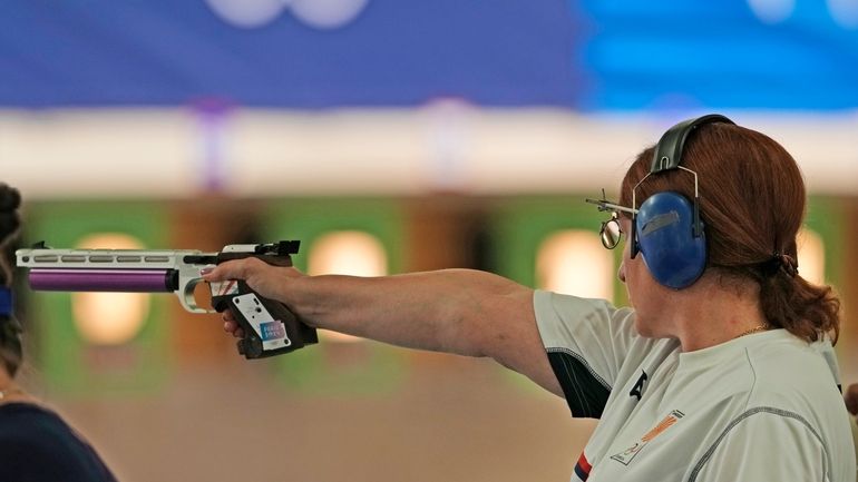 Georgia's Nino Salukvadze competes in the 10m air pistol women's...