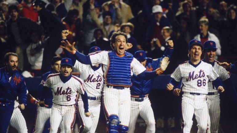 Catcher Gary Carter leads the cheers as the New York...